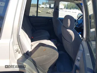 1997 Jeep Grand Cherokee Laredo with VIN 1J4GZ58S7VC713517, listed as a IAAI auction lot 42062214 with 205,533 mi miles. Bid and sale history available at carsss.com. Image 8.