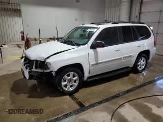 2005 GMC Envoy SLE with VIN 1GKDT13S452315816, listed as a Copart auction lot 52863805 with 128,922 mi miles and Salvage Title. Bid and sale history available at carsss.com. Image 1.