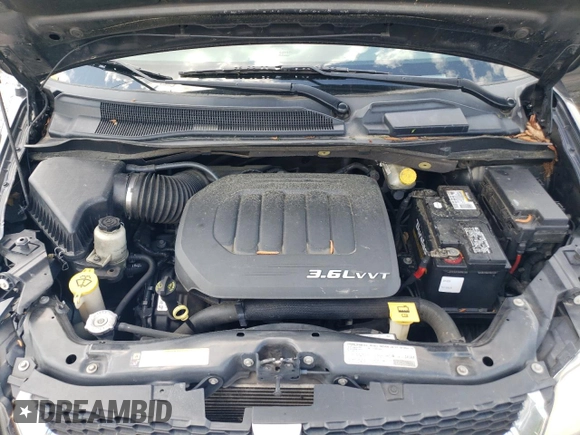 2013 Dodge Grand Caravan SXT with VIN 2C4RDGCG0DR523978, listed as a Copart auction lot 52805515 with 176,515 mi miles and Salvage Title. Bid and sale history available at DreamBid. Image 12.