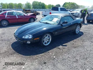 2002 Jaguar XK with VIN SAJDA42C12NA30499, listed as a IAAI auction lot 41954577 with 77,152 mi miles and . Bid and sale history available at DreamBid. Image 2.
