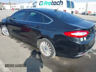 2013 Ford Fusion SE Hybrid with VIN 3FA6P0LU4DR325699, listed as a IAAI auction lot 41677237 with 129,004 mi miles. Bid and sale history available at carsss.com. Image 3.