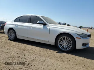 2013 BMW 3 Series 328i xDrive with VIN WBA3B3C51DF532714, listed as a Copart auction lot 57854735 with 140,650 mi miles and Salvage title. Bid and sale history available at DreamBid. Image 4.