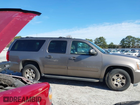 2011 Chevrolet Suburban LT with VIN 1GNSCJE00BR122636, listed as a IAAI auction lot 41594772 with 202,433 mi miles. Bid and sale history available at carsss.com. Image 12.