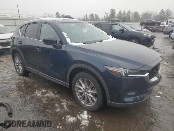 2021 Mazda CX-5 Grand Touring with VIN JM3KFBDM0M0391325, listed as a Copart auction lot 44863215 with 21,997 mi miles and Salvage Title. Bid and sale history available at DreamBid. Image 4.