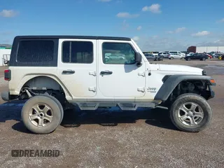 2020 Jeep Wrangler Unlimited Sport with VIN 1C4HJXDM2LW262867, listed as a IAAI auction lot 42303520 with 56,461 mi miles and . Bid and sale history available at DreamBid. Image 13.