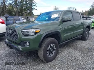 2021 Toyota Tacoma 4WD SR with VIN 3TMCZ5AN5MM437358, listed as a IAAI auction lot 42000234 with 47,295 mi miles. Bid and sale history available at carsss.com. Image 2.