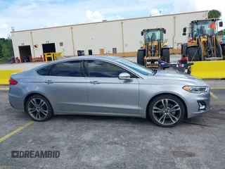 2020 Ford Fusion Titanium with VIN 3FA6P0D95LR199443, listed as a IAAI auction lot 42721371 with 77,592 mi miles and . Bid and sale history available at DreamBid. Image 13.