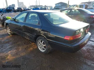 2001 Toyota Camry CE with VIN JT2BG22K210598164, listed as a IAAI auction lot 41457913 with 129,198 mi miles. Bid and sale history available at carsss.com. Image 3.