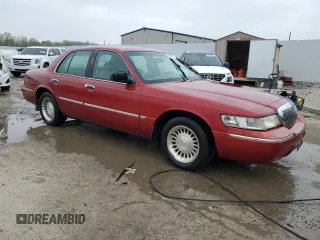 2000 Mercury Grand Marquis LS z VIN 2MEFM75WXYX726819, wystawiony jako Copart lot #52873675 z przebiegiem 144 692 mil mil oraz Nie do naprawy. Historia ofert i sprzedaży dostępna na DreamBid. Obrazek 4.