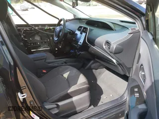 2021 Toyota Prius L Eco with VIN JTDKAMFU3M3140233, listed as a IAAI auction lot 42182685 with 38,842 mi miles and . Bid and sale history available at DreamBid. Image 5.