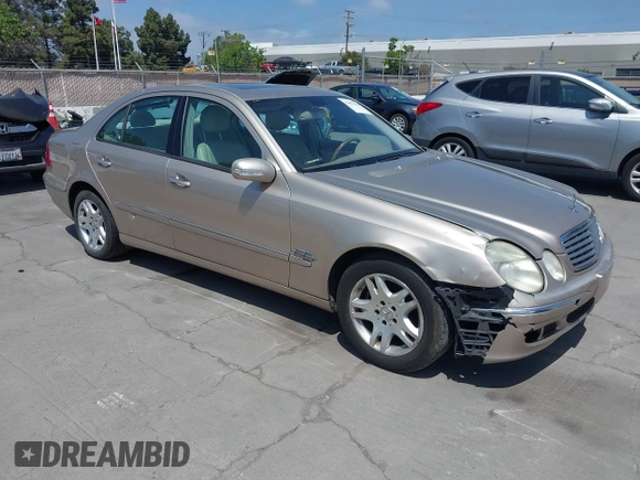 2003 Mercedes-Benz E-Class 3.2L with VIN WDBUF65JX3A236768, listed as a IAAI auction lot 42094824 with 251,896 mi miles. Bid and sale history available at carsss.com. Image 1.