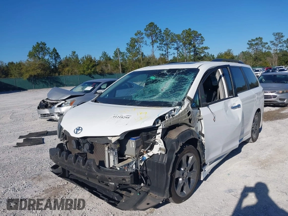 2014 Toyota Sienna SE with VIN 5TDXK3DC4ES487772, listed as a IAAI auction lot 41218295 with 153,368 mi miles and . Bid and sale history available at DreamBid. Image 2.
