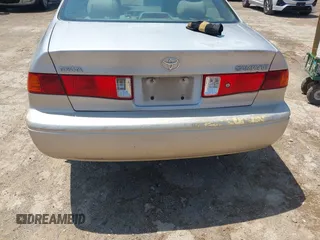 2000 Toyota Camry CE z VIN 4T1BG22K5YU731201, wystawiony jako IAAI lot #42094098 z przebiegiem Nie podano mil oraz . Historia ofert i sprzedaży dostępna na DreamBid. Obrazek 13.