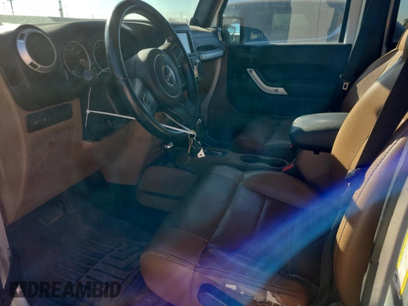 2012 Jeep Wrangler Unlimited Call of Duty MW3 с VIN 1C4BJWFG3CL103865, выставлен на аукционе Copart как лот 74237754 с пробегом 104 232 миль миль и Списание • Salvage title. История ставок и продаж доступна на DreamBid. Изображение 7.