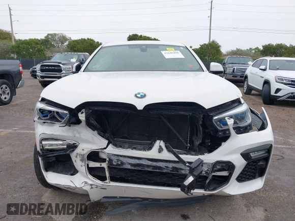 2021 BMW X6 xDrive40i z VIN 5UXCY6C00M9F88215, wystawiony jako IAAI lot #41646498 z przebiegiem 43 587 mil mil oraz . Historia ofert i sprzedaży dostępna na DreamBid. Obrazek 6.