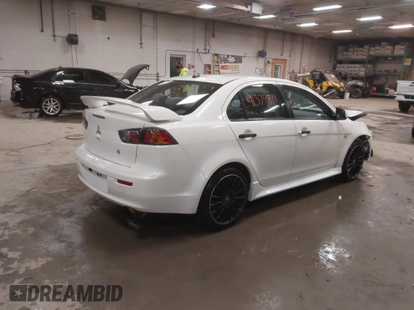 2014 Mitsubishi Lancer GT with VIN JA32U8FWXEU016230, listed as a IAAI auction lot 41379899 with 108,511 mi miles. Bid and sale history available at carsss.com. Image 4.