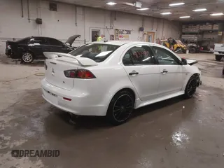 2014 Mitsubishi Lancer GT with VIN JA32U8FWXEU016230, listed as a IAAI auction lot 41379899 with 108,511 mi miles. Bid and sale history available at carsss.com. Image 4.