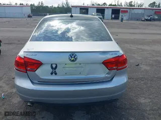 2015 Volkswagen Passat 1.8T SE w/Sunroof & Nav with VIN 1VWBT7A31FC105636, listed as a IAAI auction lot 41211815 with 64,684 mi miles. Bid and sale history available at carsss.com. Image 16.