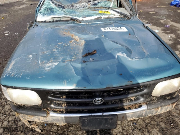 1994 Mazda B-Series 4WD Truck LE with VIN 4F4DR17X5RTN10704, listed as a Copart auction lot 87230804 with 227,476 mi miles and Salvage Title. Bid and sale history available at carsss.com. Image 12.
