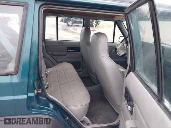 1996 Jeep Cherokee Sport with VIN 1J4FJ68S5TL235507, listed as a IAAI auction lot 41834736 with 174,634 mi miles. Bid and sale history available at carsss.com. Image 8.