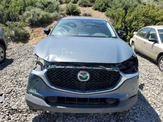 2023 Mazda CX-30 S Carbon Edition with VIN 3MVDMBCM1PM524019, listed as a Copart auction lot 57079355 with 46,737 mi miles and Salvage title. Bid and sale history available at DreamBid. Image 5.