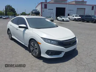 2018 Honda Civic EX-T z VIN JHMFC1F37JX033660, wystawiony jako IAAI lot #42190445 z przebiegiem 88 869 mil mil oraz . Historia ofert i sprzedaży dostępna na DreamBid. Obrazek 1.