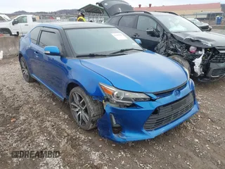 2015 Scion tC z VIN JTKJF5C74FJ005433, wystawiony jako IAAI lot #41485028 z przebiegiem 142 407 mil mil oraz . Historia ofert i sprzedaży dostępna na DreamBid. Obrazek 1.