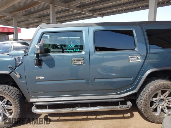 2005 Hummer H2 SUV with VIN 5GRGN23U25H107505, listed as a IAAI auction lot 41703768 with 213,723 mi miles. Bid and sale history available at carsss.com. Image 14.