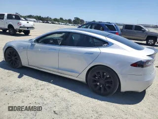 2016 Tesla Model S 90D с VIN 5YJSA1E23GF144496, выставлен на аукционе Copart как лот 64080845 с пробегом 34 847 миль миль и Списание • Salvage title. История ставок и продаж доступна на DreamBid. Изображение 2.