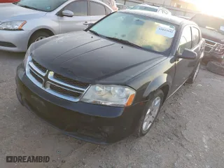 2014 Dodge Avenger SE with VIN 1C3CDZAB3EN148292, listed as a IAAI auction lot 42043642 with 134,676 mi miles. Bid and sale history available at carsss.com. Image 2.