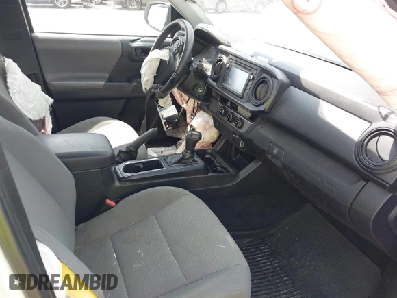 2018 Toyota Tacoma SR with VIN 5TFRX5GN6JX129435, listed as a IAAI auction lot 42205055 with 105,985 mi miles and . Bid and sale history available at DreamBid. Image 5.