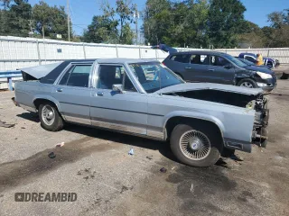 1989 Ford Crown Victoria z VIN 2FABP74F2KX141884, wystawiony jako Copart lot #74934494 z przebiegiem 84 761 mil mil oraz Szkoda całkowita • Salvage title. Historia ofert i sprzedaży dostępna na DreamBid. Obrazek 4.