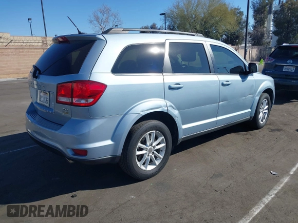 2013 Dodge Journey SXT with VIN 3C4PDCBG5DT674863, listed as a IAAI auction lot 41670225 with 207,524 mi miles. Bid and sale history available at carsss.com. Image 4.