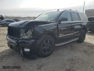 2015 GMC Yukon Denali with VIN 1GKS1CKJ1FR303049, listed as a Copart auction lot 82435514 with 100,693 mi miles and Salvage Title. Bid and sale history available at carsss.com. Image 1.