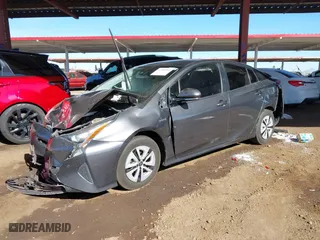 2018 Toyota Prius Two with VIN JTDKARFUXJ3062963, listed as a IAAI auction lot 41588989 with 114,842 mi miles. Bid and sale history available at carsss.com. Image 2.