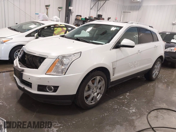 2012 Cadillac SRX Premium Collection z VIN 3GYFNFE38CS591123, wystawiony jako IAAI lot #41827636 z przebiegiem 143 867 mil mil oraz . Historia ofert i sprzedaży dostępna na DreamBid. Obrazek 22.