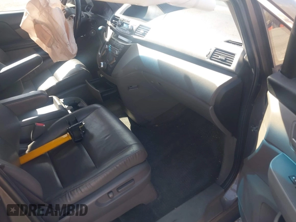 2012 Honda Odyssey EX-L with VIN 5FNRL5H61CB095789, listed as a IAAI auction lot 42065507 with 138,570 mi miles and . Bid and sale history available at DreamBid. Image 5.