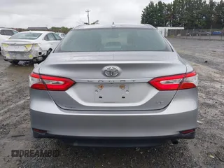 2019 Toyota Camry LE z VIN 4T1B11HK0KU698215, wystawiony jako IAAI lot #42319699 z przebiegiem 54 864 mil mil oraz . Historia ofert i sprzedaży dostępna na DreamBid. Obrazek 17.