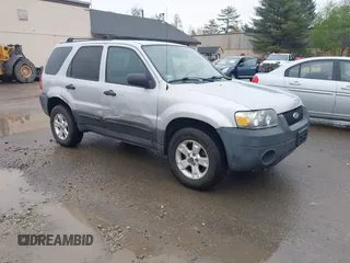 2005 Ford Escape XLT with VIN 1FMCU93115KC10947, listed as a IAAI auction lot 42215066 with 128,475 mi miles and . Bid and sale history available at DreamBid. Image 1.