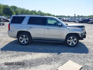 2015 Chevrolet Tahoe LTZ z VIN 1GNSCCKC8FR149888, wystawiony jako IAAI lot #42049804 z przebiegiem 182 991 mil mil oraz . Historia ofert i sprzedaży dostępna na DreamBid. Obrazek 13.