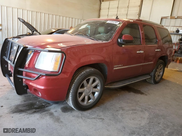 2012 GMC Yukon Denali with VIN 1GKS1EEF9CR283955, listed as a Copart auction lot 51055245 with 124,321 mi miles and Salvage Title. Bid and sale history available at carsss.com. Image 1.