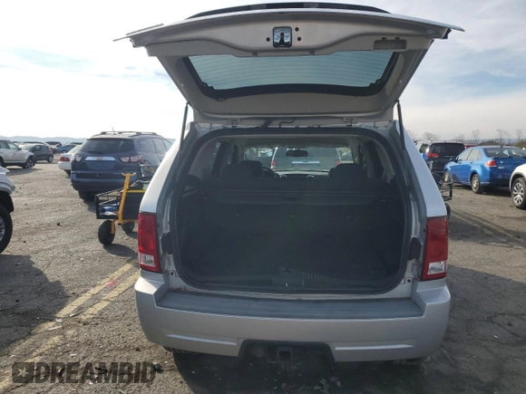 2009 Jeep Grand Cherokee Laredo with VIN 1J8HR48P89C552691, listed as a Copart auction lot 82080964 with 100,876 mi miles and Salvage Title. Bid and sale history available at carsss.com. Image 6.