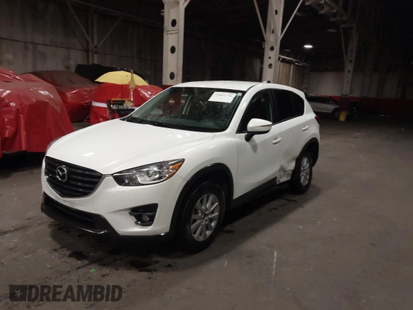 2016 Mazda CX-5 Touring z VIN JM3KE4CY0G0853261, wystawiony jako IAAI lot #41861176 z przebiegiem 63 491 mil mil oraz . Historia ofert i sprzedaży dostępna na DreamBid. Obrazek 2.
