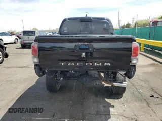 2019 Toyota Tacoma SR z VIN 3TMCZ5AN1KM253032, wystawiony jako Copart lot #52598445 z przebiegiem 69 489 mil mil oraz Szkoda całkowita • Salvage title. Historia ofert i sprzedaży dostępna na DreamBid. Obrazek 6.