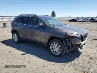 2014 Jeep Cherokee Limited z VIN 1C4PJMDS1EW170001, wystawiony jako Copart lot #57645655 z przebiegiem 154 098 mil mil oraz Szkoda całkowita • Salvage title. Historia ofert i sprzedaży dostępna na DreamBid. Obrazek 4.