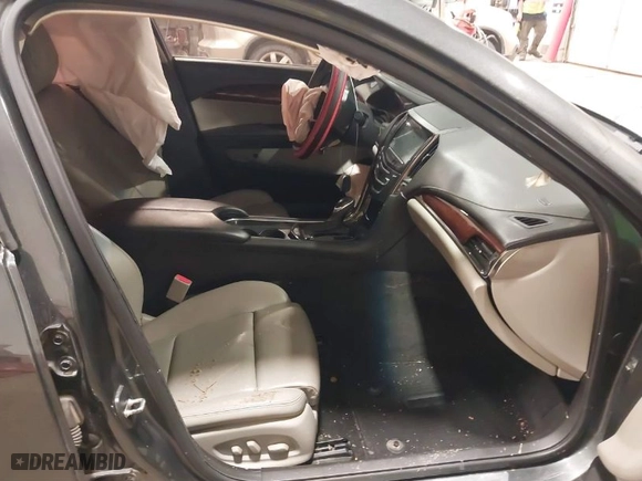 2015 Cadillac ATS Performance with VIN 1G6AC5SX3F0109826, listed as a IAAI auction lot 41205716 with 128,922 mi miles. Bid and sale history available at carsss.com. Image 5.