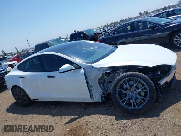 2023 Tesla Model S with VIN 5YJSA1E51PF499919, listed as a IAAI auction lot 42459166 with 6,612 mi miles and . Bid and sale history available at DreamBid. Image 14.