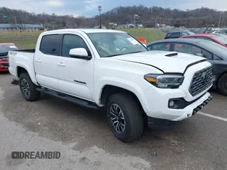 2023 Toyota Tacoma SR with VIN 3TMCZ5AN2PM552746, listed as a IAAI auction lot 41209057 with 48,527 mi miles and . Bid and sale history available at DreamBid. Image 1.