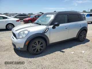 2013 MINI Countryman S with VIN WMWZC3C58DWP20864, listed as a Copart auction lot 64034385 with 72,487 mi miles and Clean title. Bid and sale history available at DreamBid. Image 1.