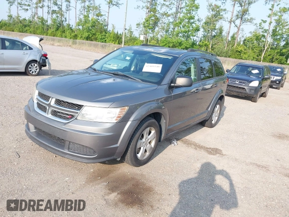 2013 Dodge Journey SE z VIN 3C4PDCAB5DT518019, wystawiony jako IAAI lot #42409340 z przebiegiem 174 339 mil mil oraz . Historia ofert i sprzedaży dostępna na DreamBid. Obrazek 2.